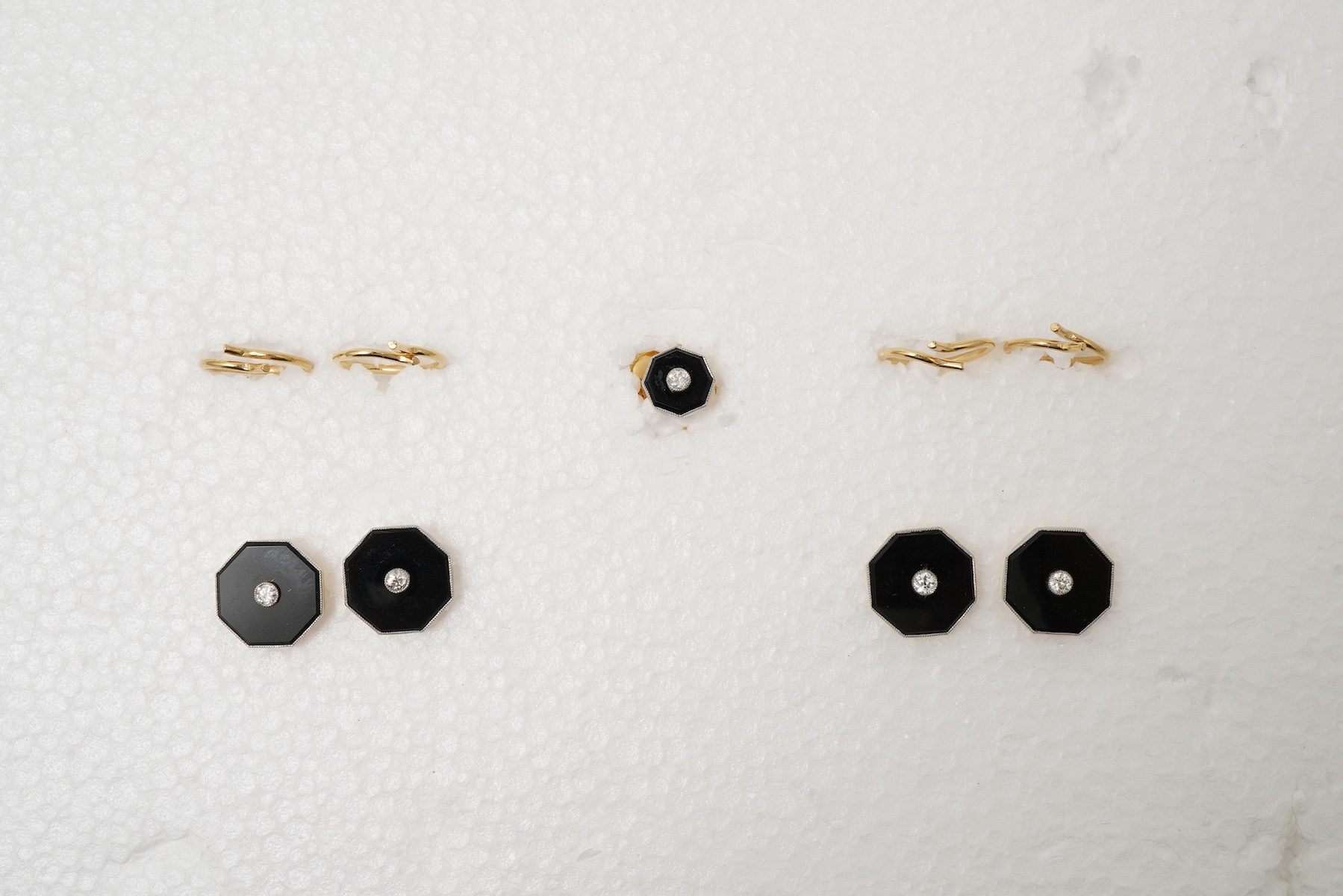 Retailed by Mappin & Webb, an Art Deco onyx and diamond dress set, circa 1920